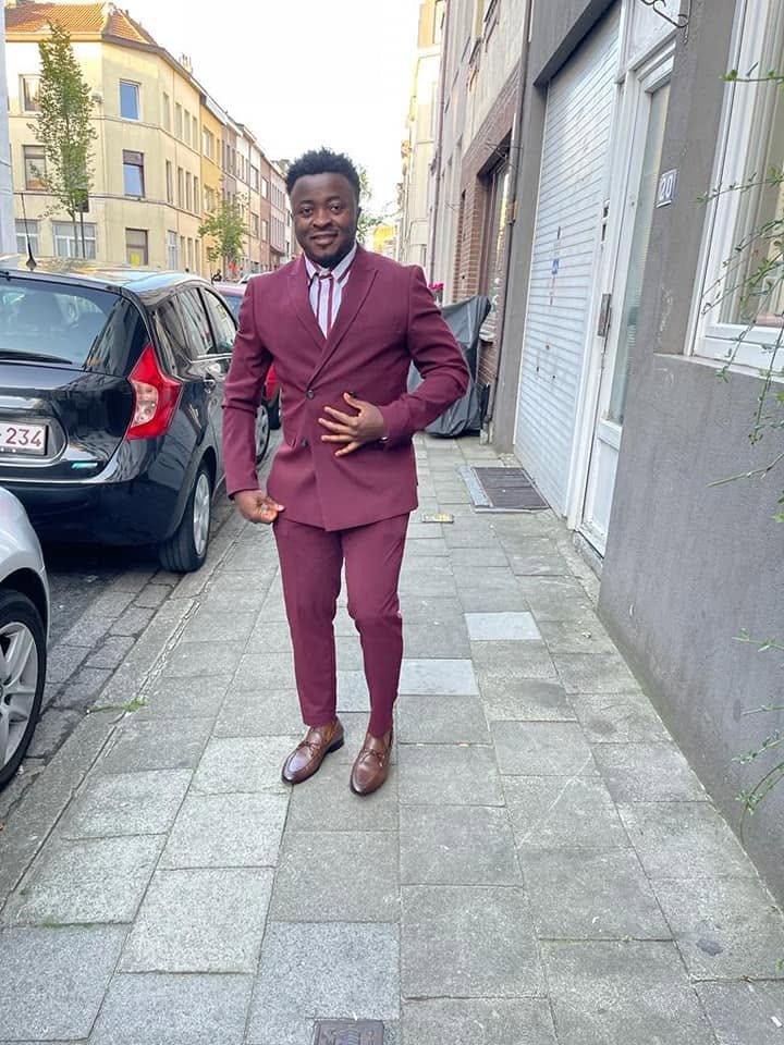 DJ Bonix in a maroon suit